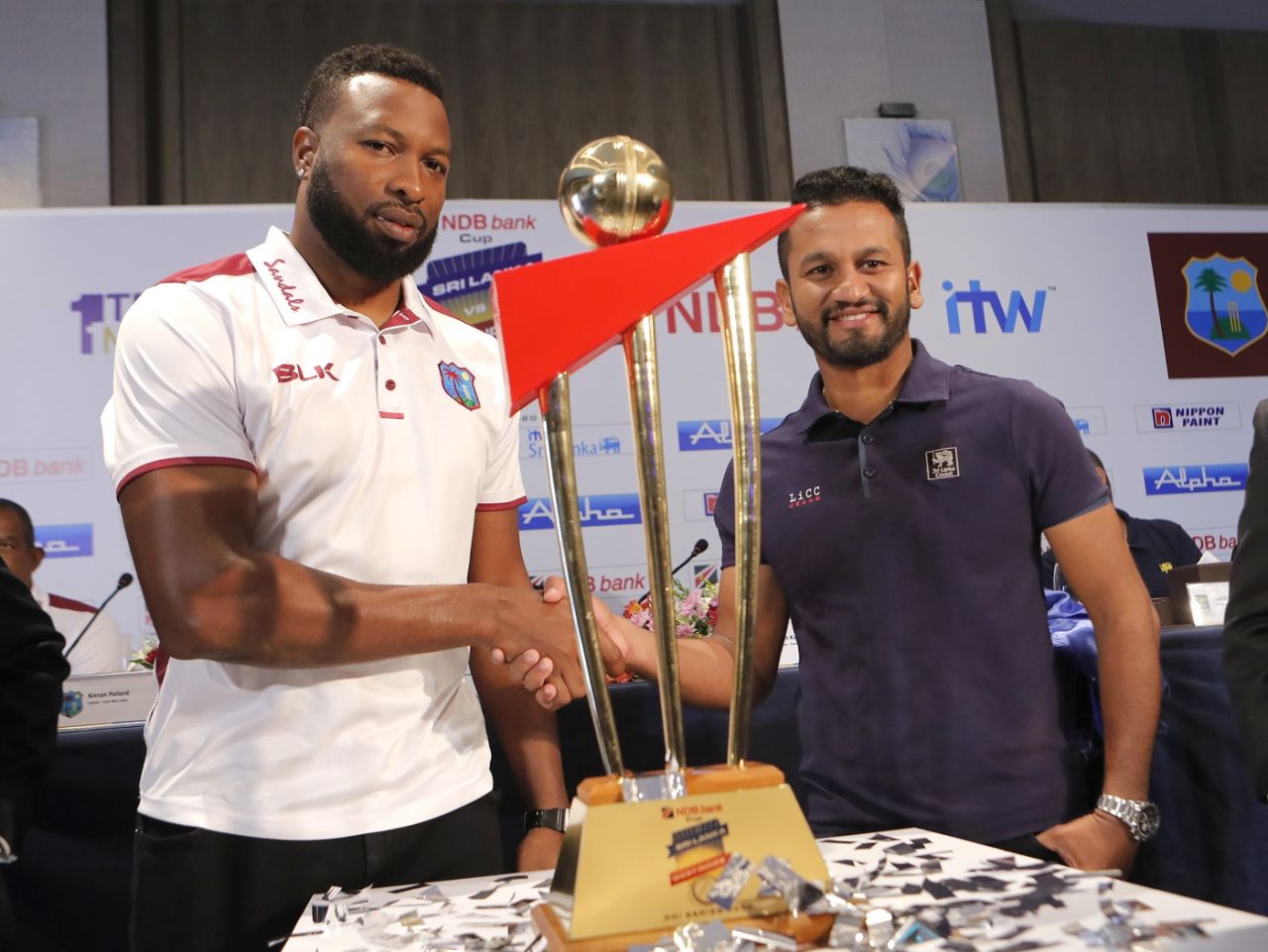 Kieron Pollard and Dimuth Karunaratne pose with the series trophy, Colombo, February 20, 2020