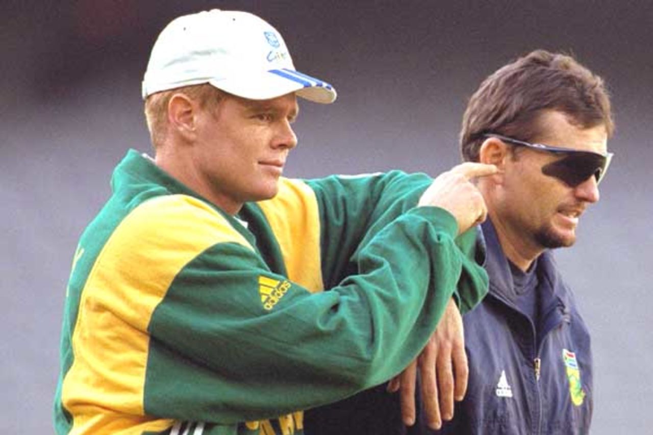 17 Aug 2000: Shaun Pollock of South Africa puts his finger in the ear of coach Graham Ford, during training for the Super Challenge 2000 between Australia and South Africa at Colonial Stadium in Melbourne, Australia.