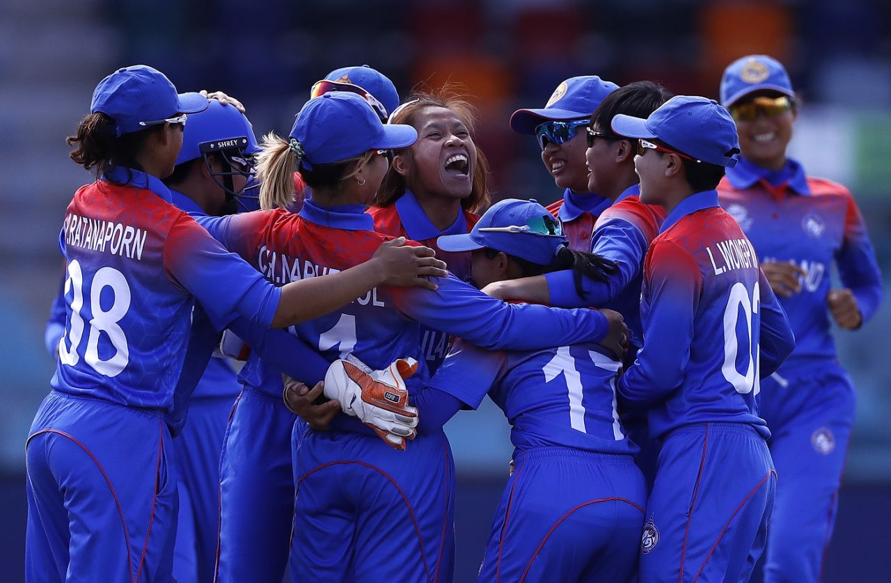 Nattaya Boochatham is mobbed by her team-mates after dismissing Amy Jones in the first over, England v Thailand, Women's T20 World Cup, Canberra, February 26, 2020