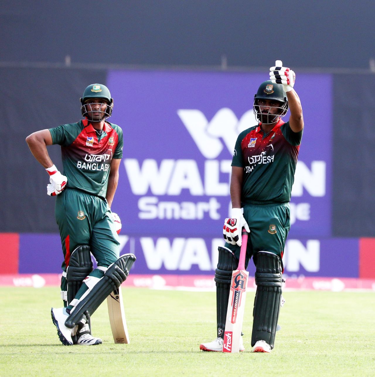 Tamim Iqbal celebrates a landmark with Mahmudullah, Bangladesh v Zimbabwe, 2nd ODI, Sylhet, March 3, 2020