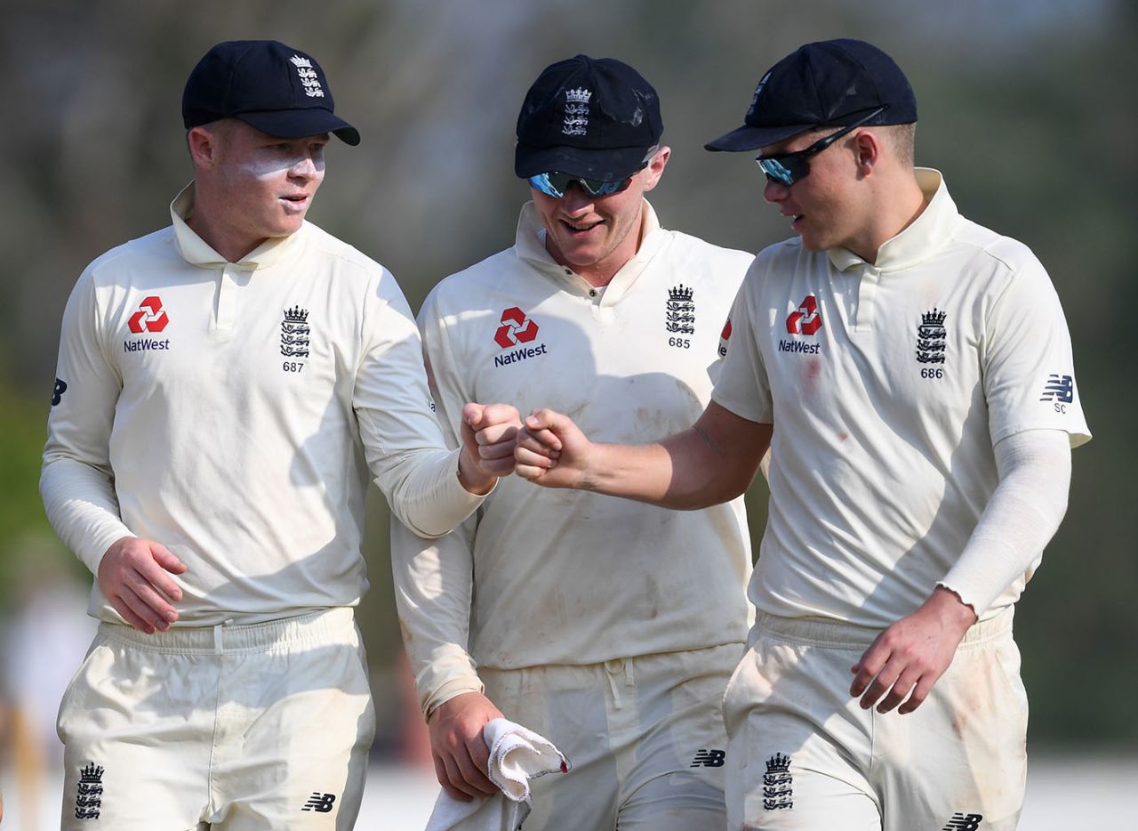 Olly Pope, Dom Bess and Sam Curran practise the 'fist bump' instead of handshakes SLC XI v England, Katunayake, March 08, 2020