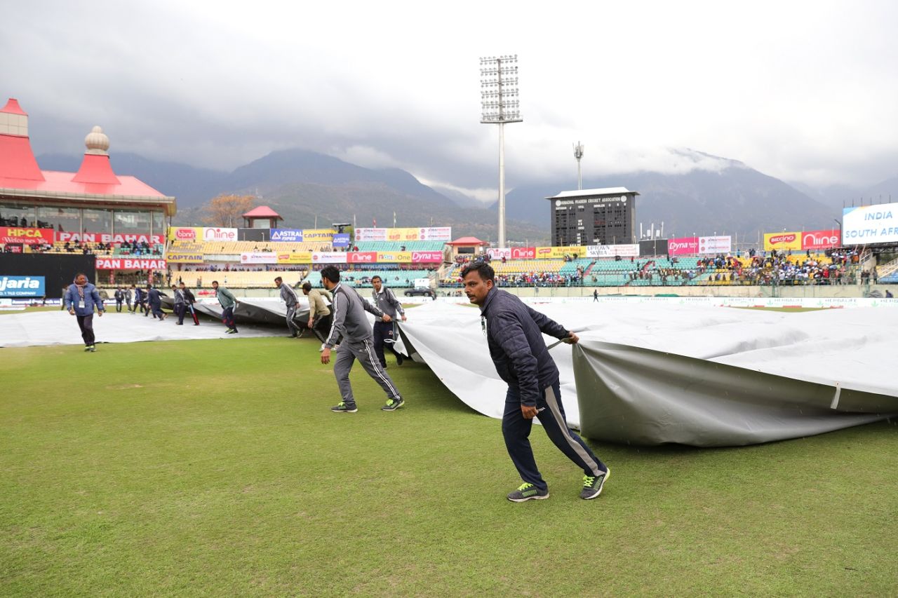 Covers being dragged on at Dharamsala after rain arrives, India v South Africa, 1st ODI, Dharamsala, March 12, 2020