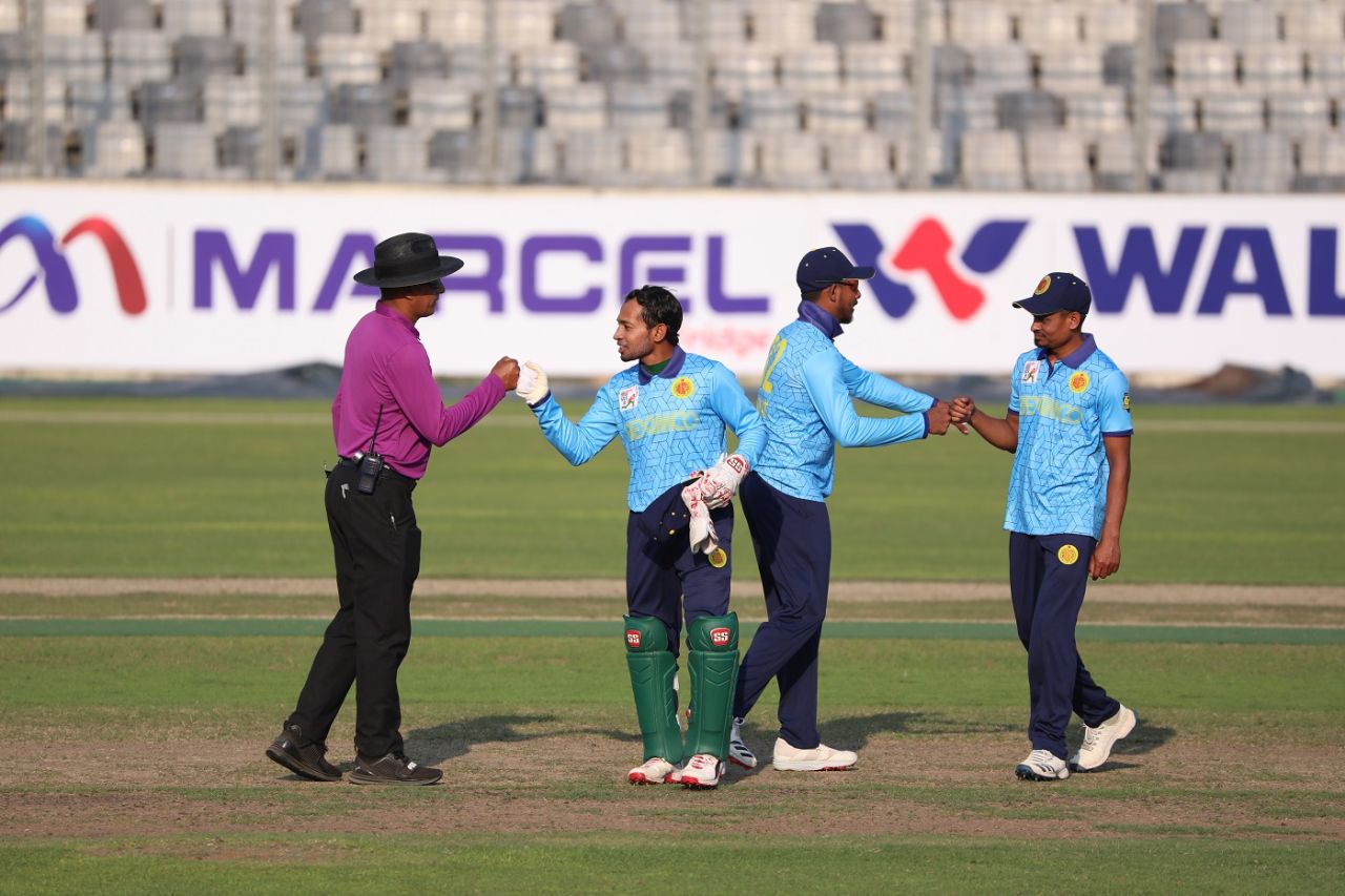 Look Ma, no hands! Mushfiqur Rahim exchanges a fist bump with the umpire, Abahani Limited v Partex Sporting Club, Dhaka Premier Division Cricket League, Dhaka, March 15, 2020
