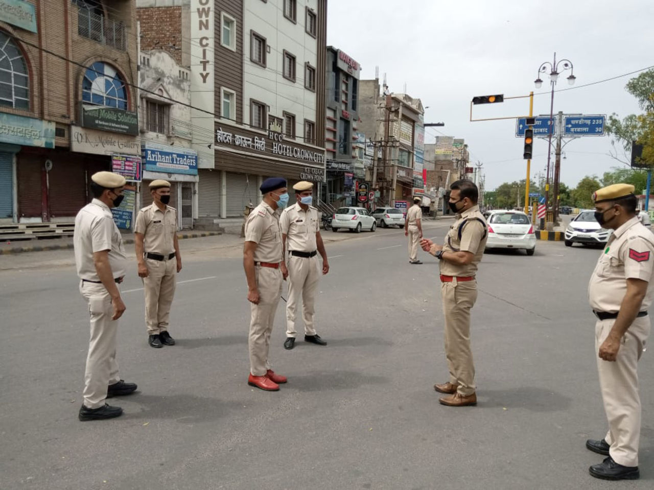 Joginder Sharma, former India player, now a police officer, talks to colleagues, Hisar, Haryana, April 2020
