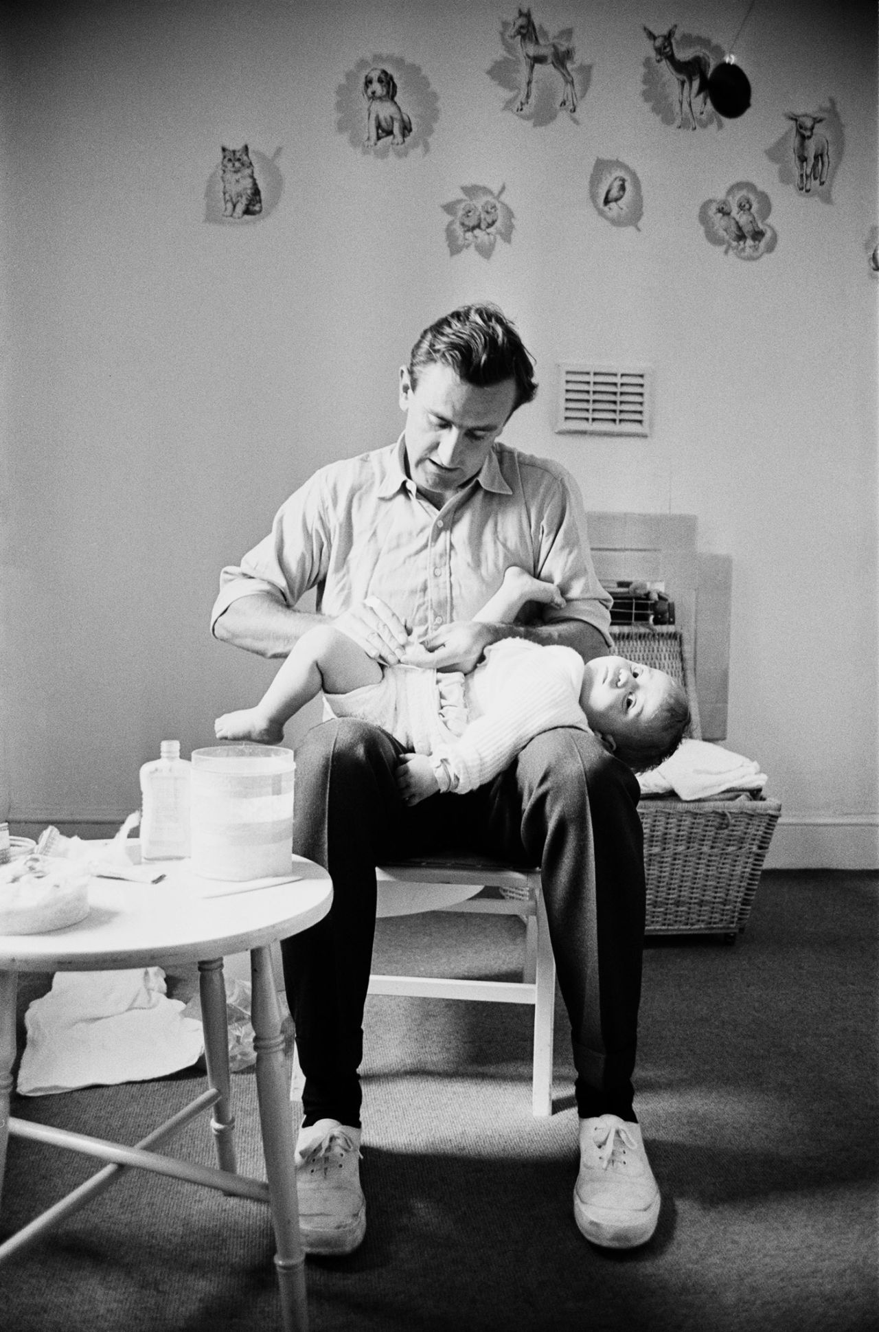 Ted Dexter changes his son's nappy, April 19, 1963