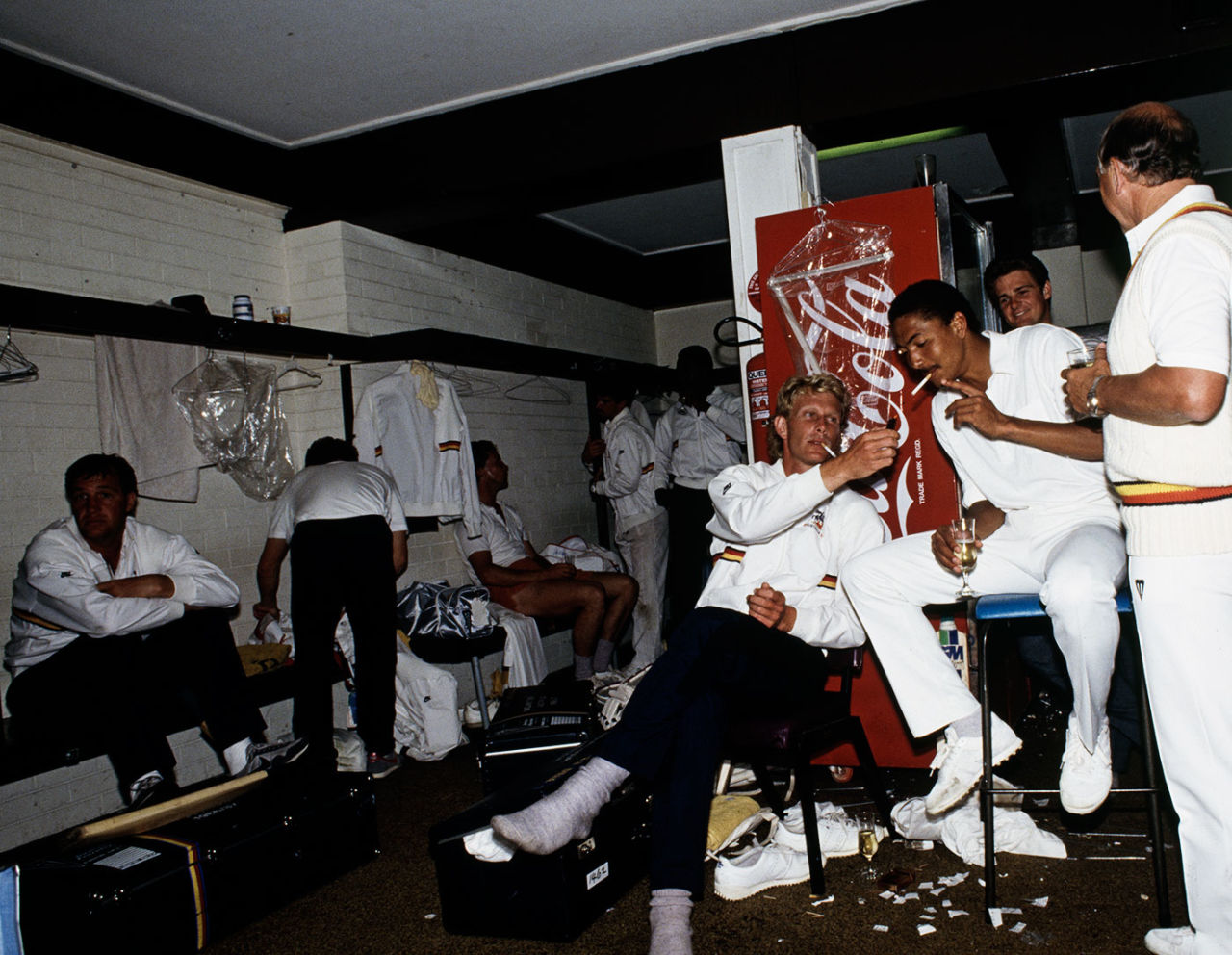 Graham Dilley lights a cigarette for Phil DeFreitas, England v Australia, 1st Test, Brisbane, 5th day, November 19, 1986