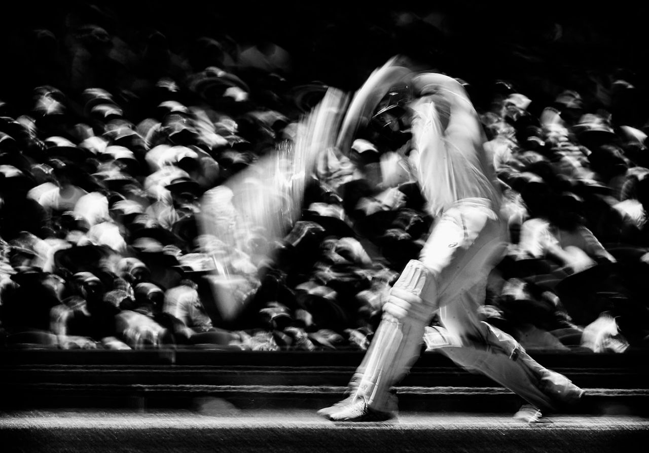 A black-and-white photograph of Steven Smith in motion while batting, Australia v India, 4th Test, Sydney, 2nd day, January 7, 2015