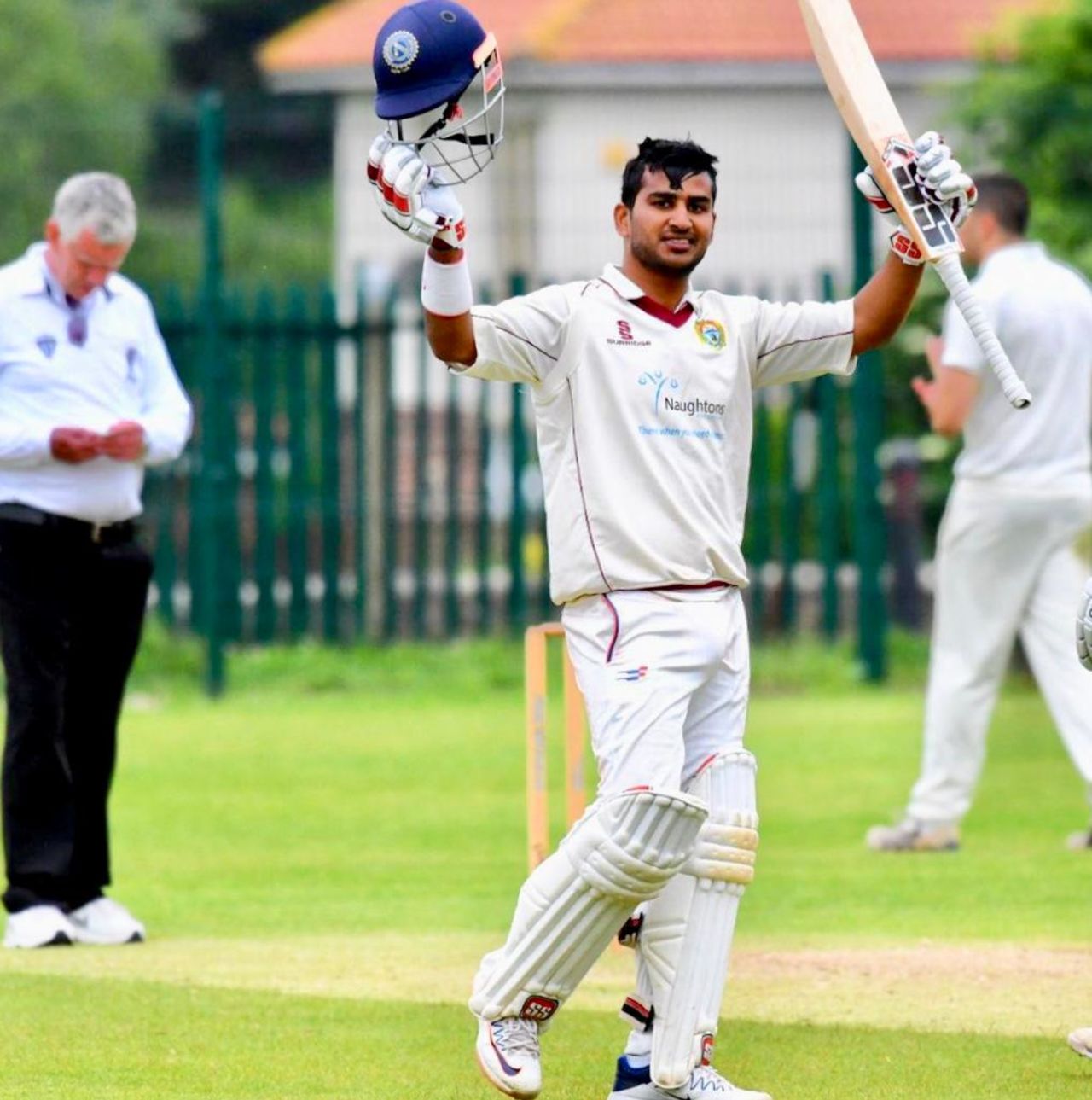 Virat Singh raises his bat after getting a hundred