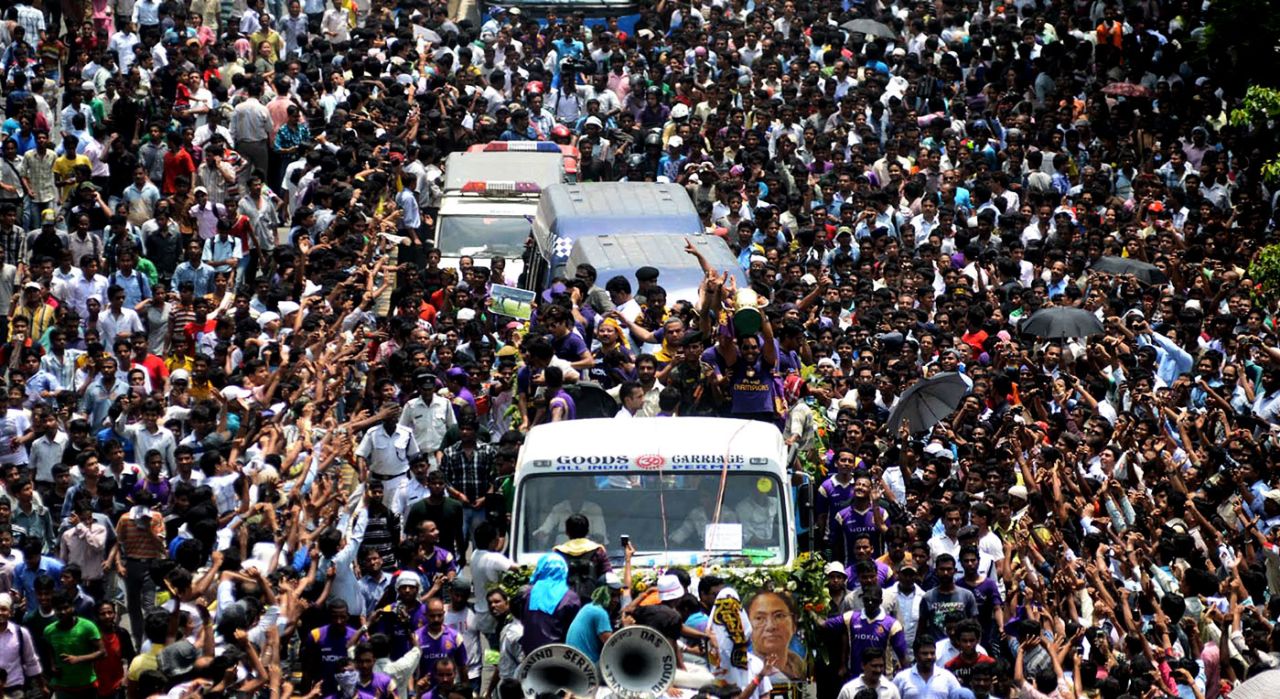 Kolkata Knight Riders ride in a procession across the streets of Kolkata, greeted by fans, May 29, 2012