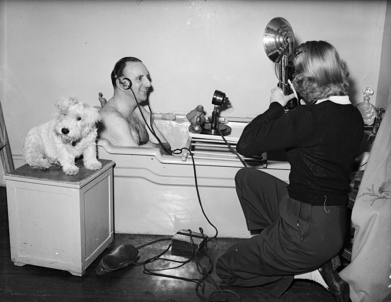 Cricket commentator Brian Johnston broadcasts from the bathtub, England, May 23, 1952