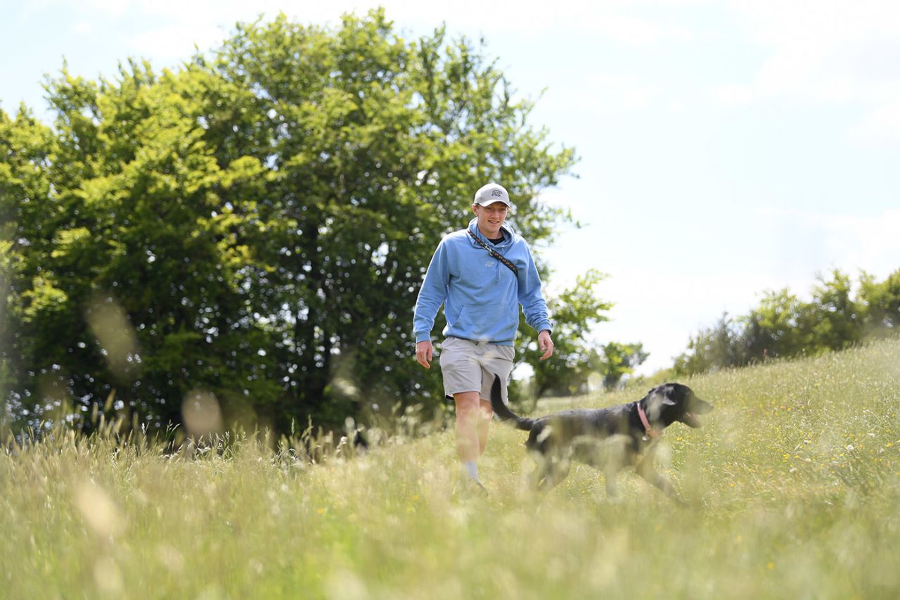 Dom Bess walking his parents' dog, Tilly, during the coronavirus lockdown, Shipton, England, May 13, 2020
