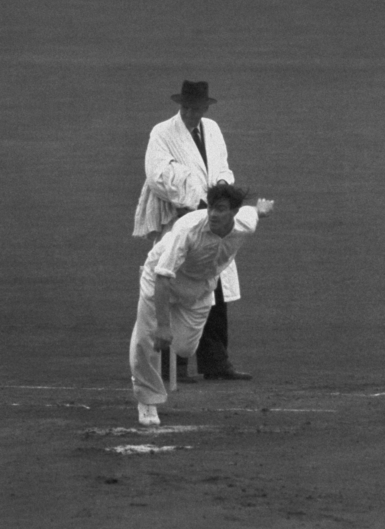 Umpire Frank Chester looks on as Fred Trueman bowls, England v India, The Oval, 1952