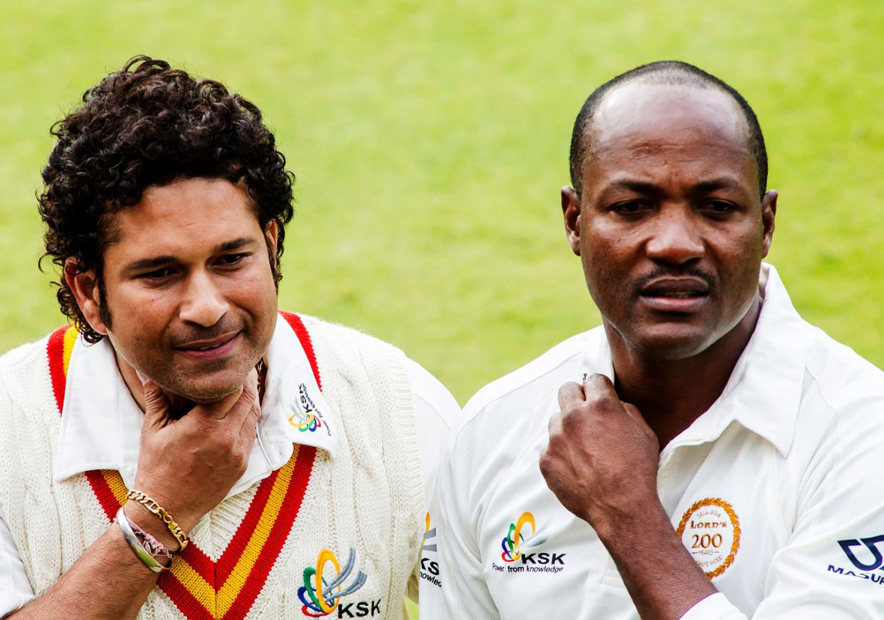Sachin Tendulkar and Brian Lara sign autographs for fans during the MCC v Rest of the World game at Lord's, July 5, 2014