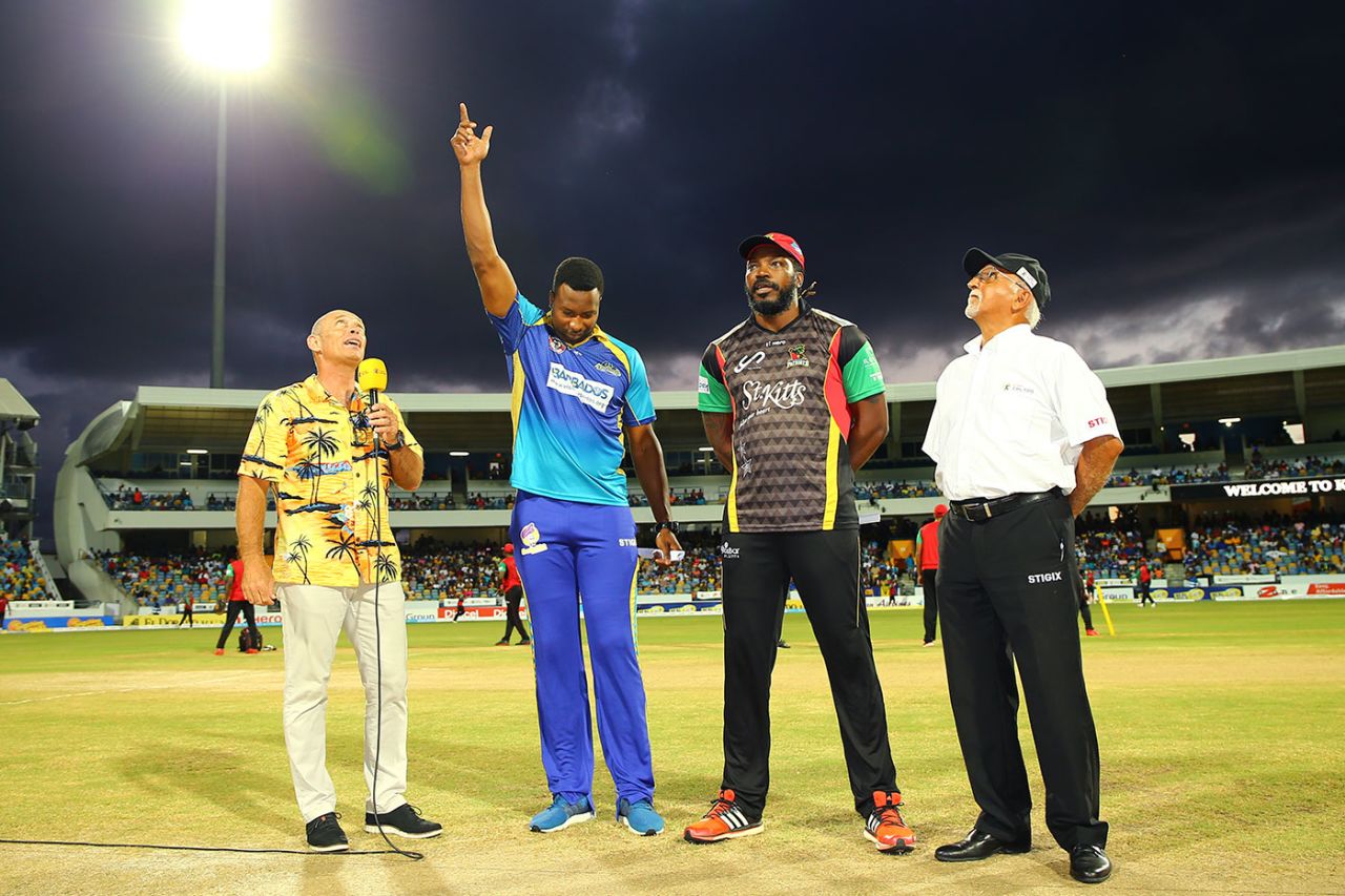 Kieron Pollard tosses the coin while Chris Gayle looks on, Barbados Tridents v St Kitts and Nevis Patriots, CPL 2017, Bridgetown, September 3, 2017