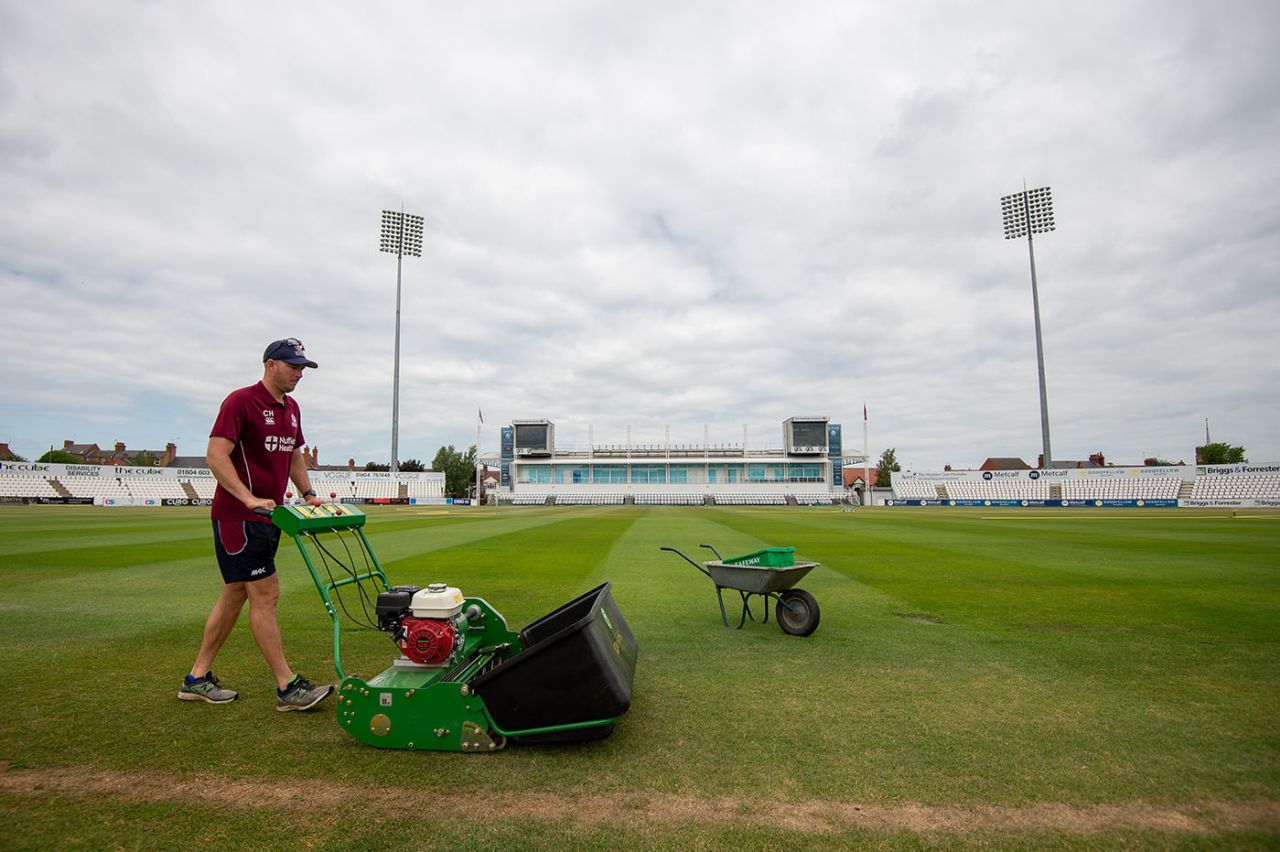 Groundsman Craig Harvey tends the Wantage Road pitch, Northamptonshire CCC, May 27, 2020