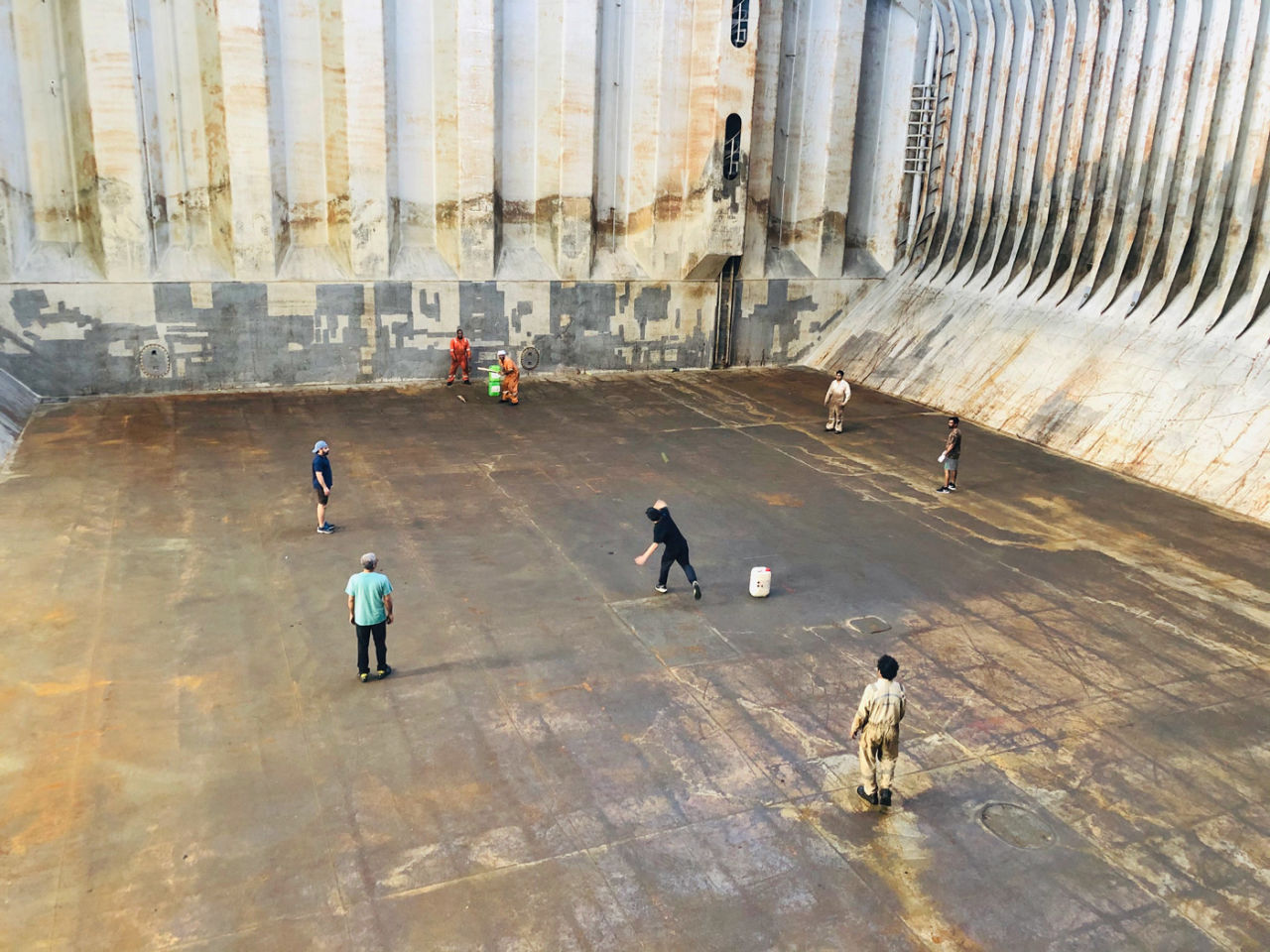 Sarker M Hasnat Lenin: Seafarers from five different countries play cricket in the cargo hold of a ship in the middle of the North Atlantic Ocean