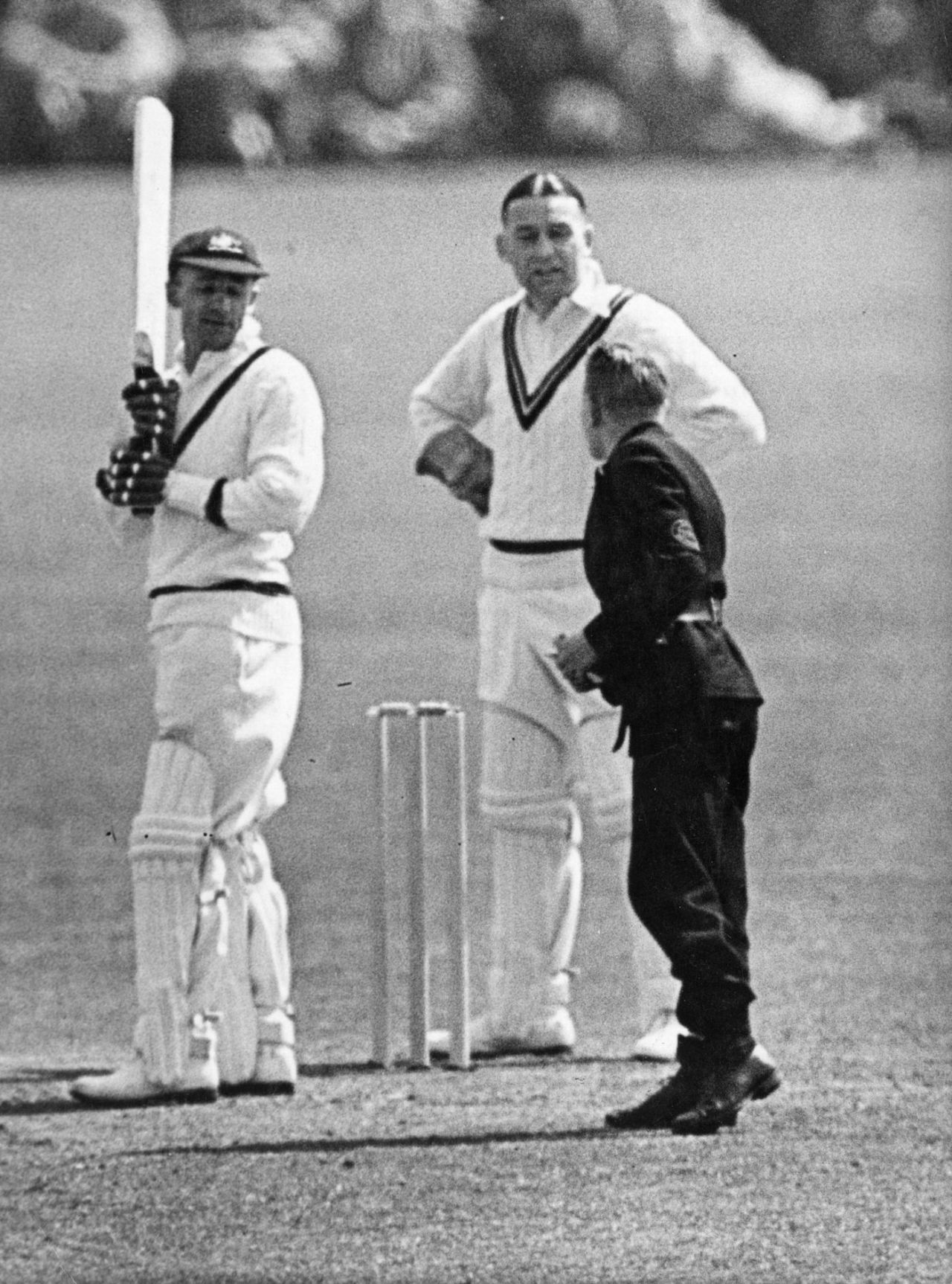 Donald Bradman receives a telegram during a game, tour match, Australians v Worcestershire, New Road, Worcester, April 21, 1938