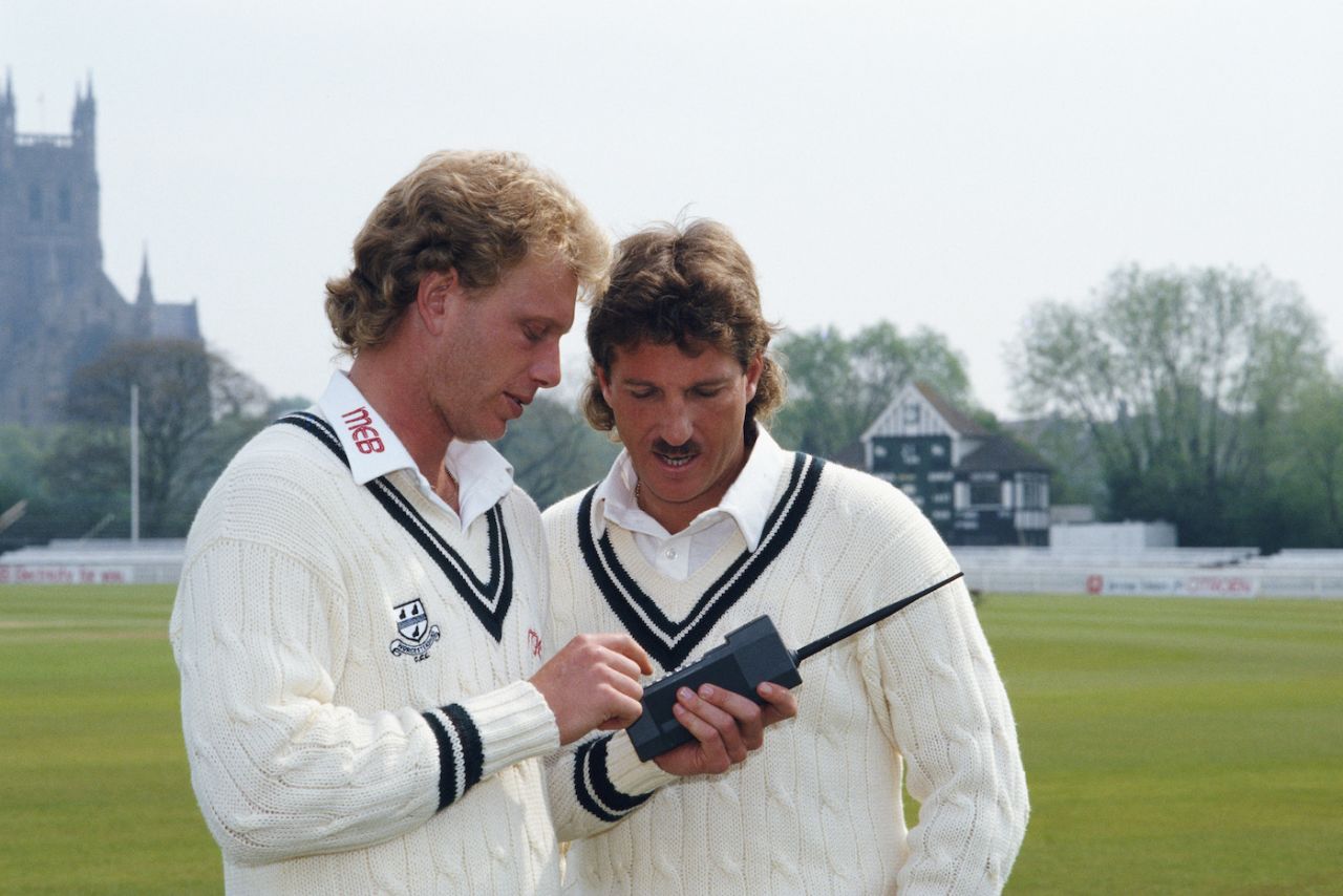 Worcestershire's new signings Graham Dilley and Ian Botham fool around with a mobile phone, New Road, Worcester, April 23, 1987