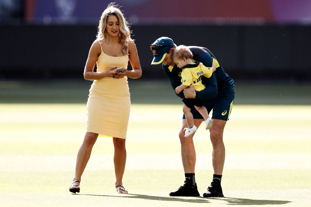 Tim Paine and his wife Bonnie walk with their son Charlie at the MCG, December 25, 2019