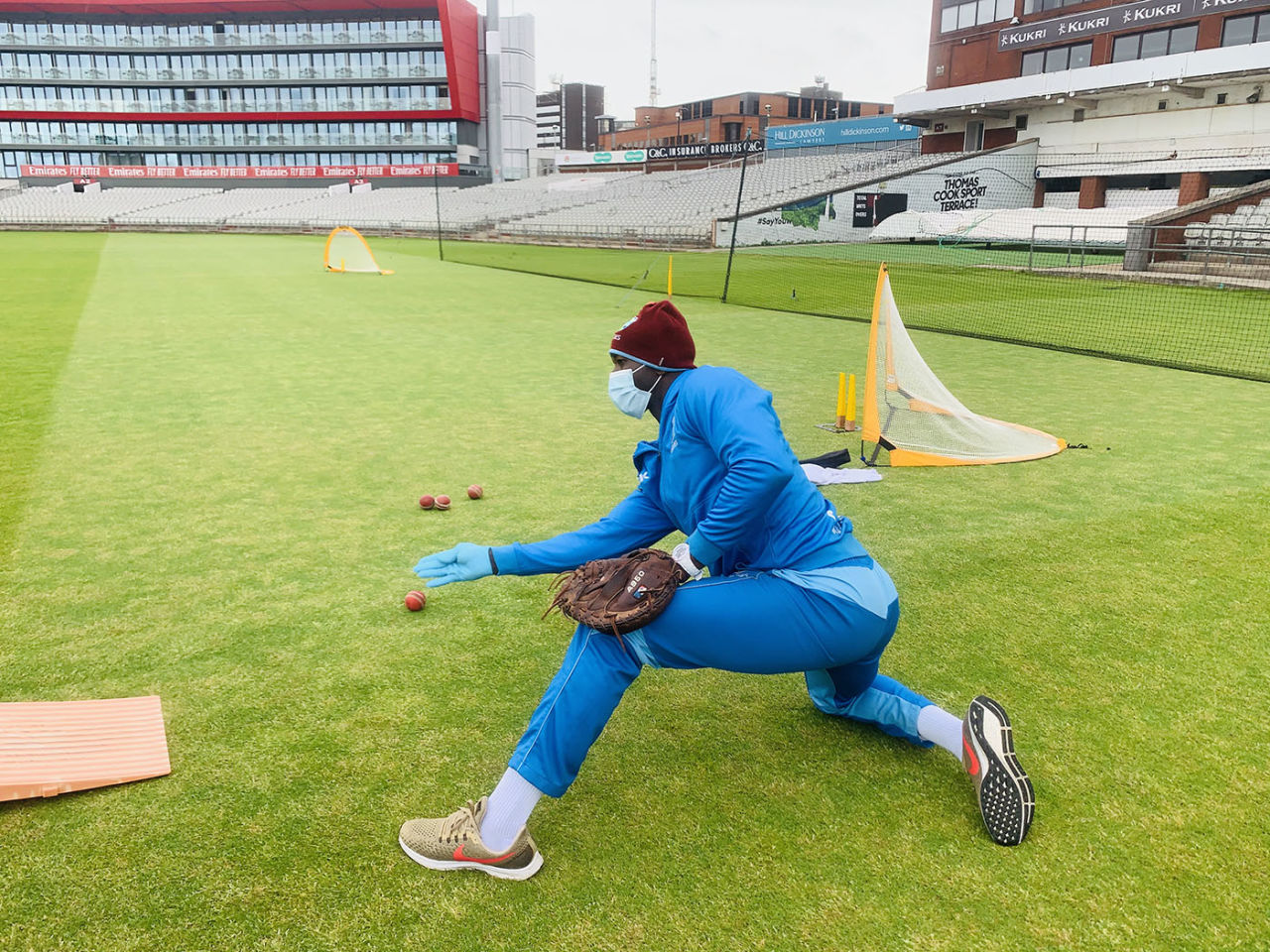West Indies fielding coach Rayon Griffith wears PPE while conducting a drill, Old Trafford, June 12, 2020