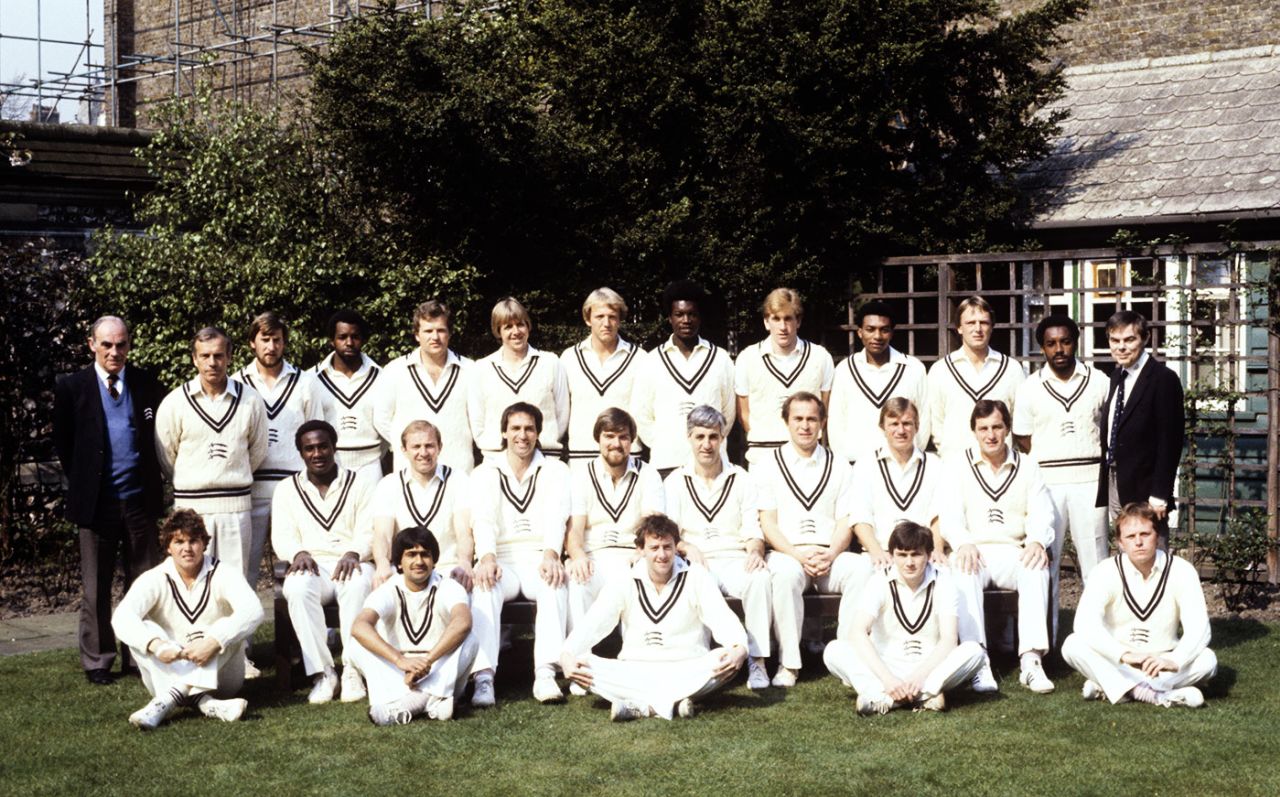 The Middlesex squad for the 1982 squad. Back row (left to right): Harry Sharp (scorer), Don Bennett, Colin Cook, Wilf Slack, Nick Kemp, Bill Merry, Andy Smith, Norman Cowans, Kevan James, Neil Williams, Paul Downton, Roland Butcher, John Miller. Middle row: Wayne Daniel, Graham Barlow, Mike Selvey, Mike Gatting, Mike Brearley (capt), Phil Edmonds, Clive Radley and John Emburey. Front row: George Ritchie, Rajesh Maru, Simon Hughes, Colin Metson, Keith Tomlins, April 20, 1982