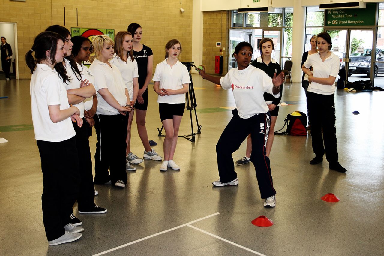 Ebony Rainford-Brent gives a coaching lesson to schoolgirls in Lambeth Hall, London, May 19, 2009