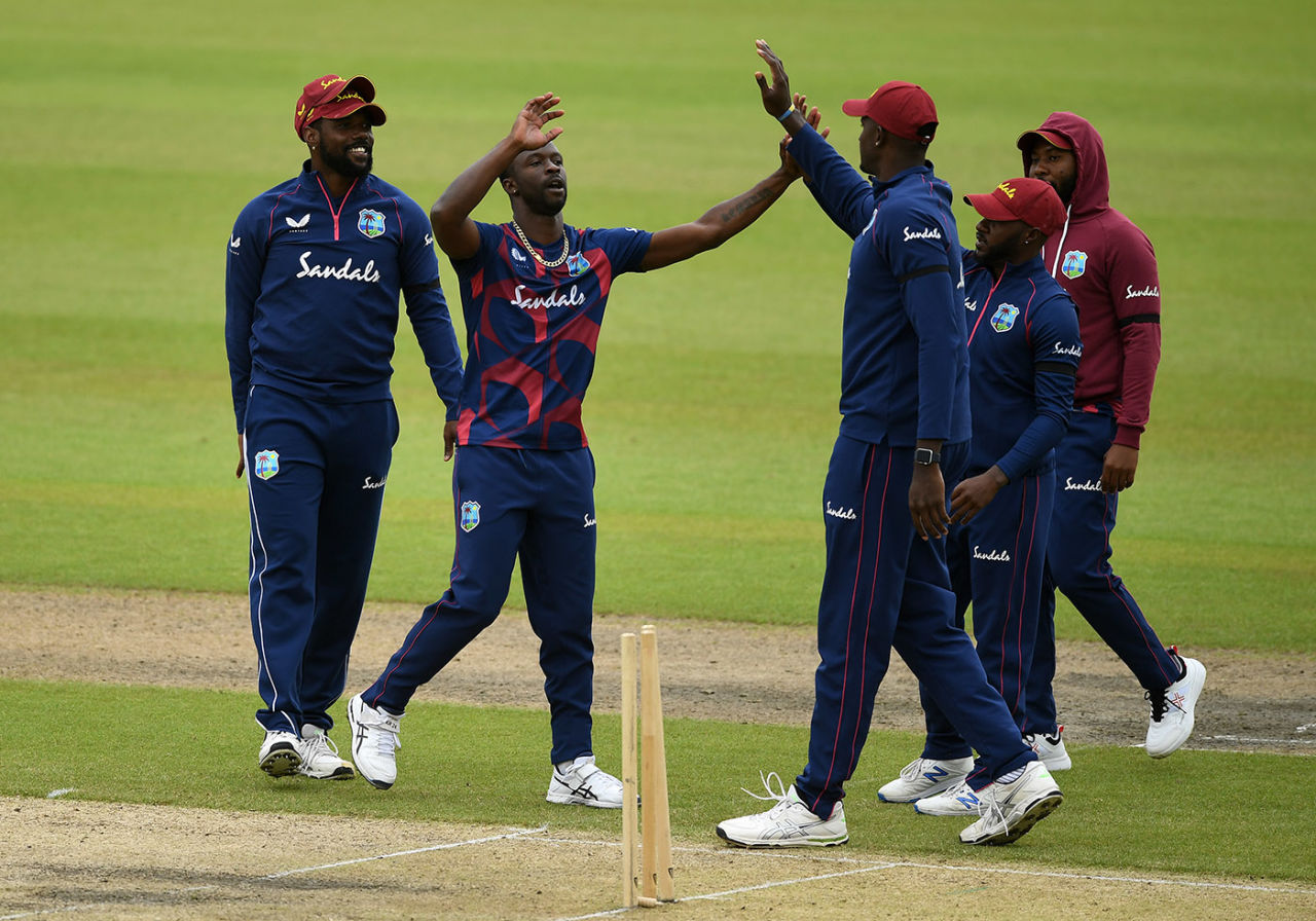 Kemar Roach celebrates with Jason Holder during Day Four of West Indies' final warm-up, intra-squad match, Old Trafford, July 02, 2020