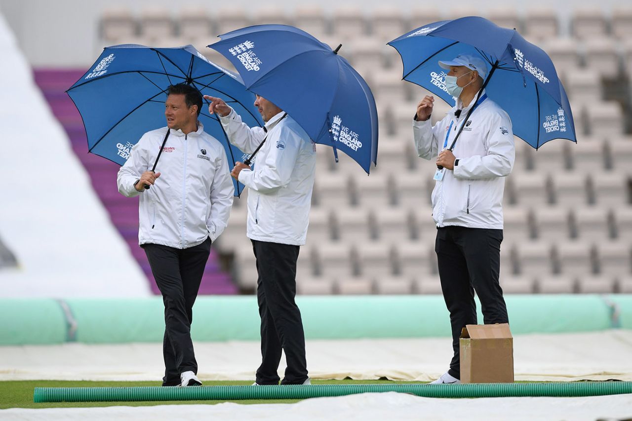 Match officials shelter from the rain, England v West Indies, 1st Test, day 1, Southampton, July 08, 2020