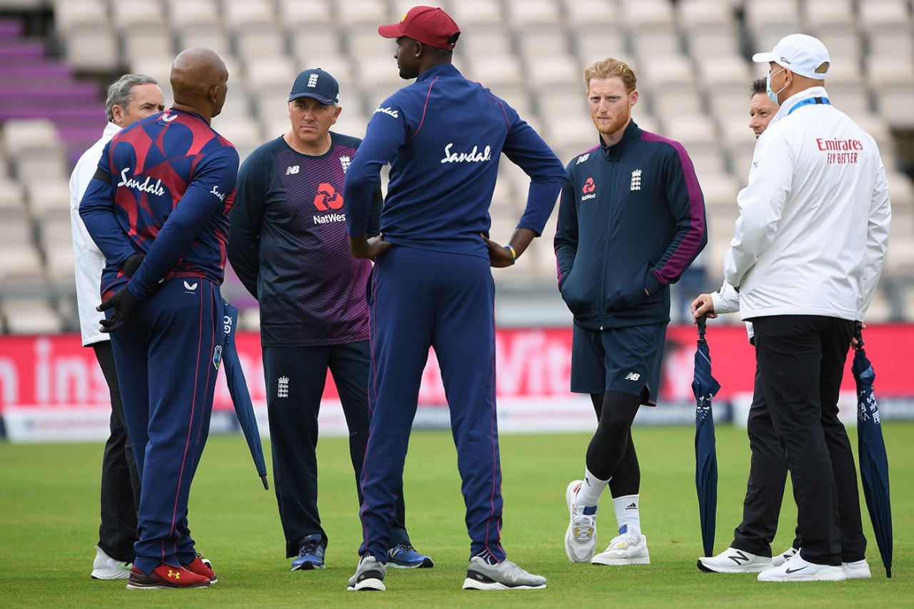 Match officials talk with the captains and coaches as rain delays the start of play, England v West Indies, 1st Test, day 1, Southampton, July 8, 2020