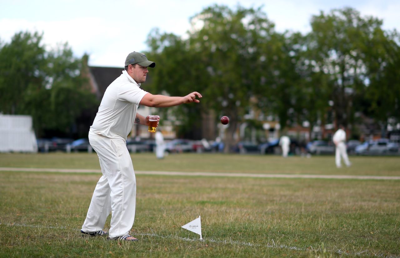 A member of the Kew Cricket Club fields on the boundary, London, July 11, 2020 