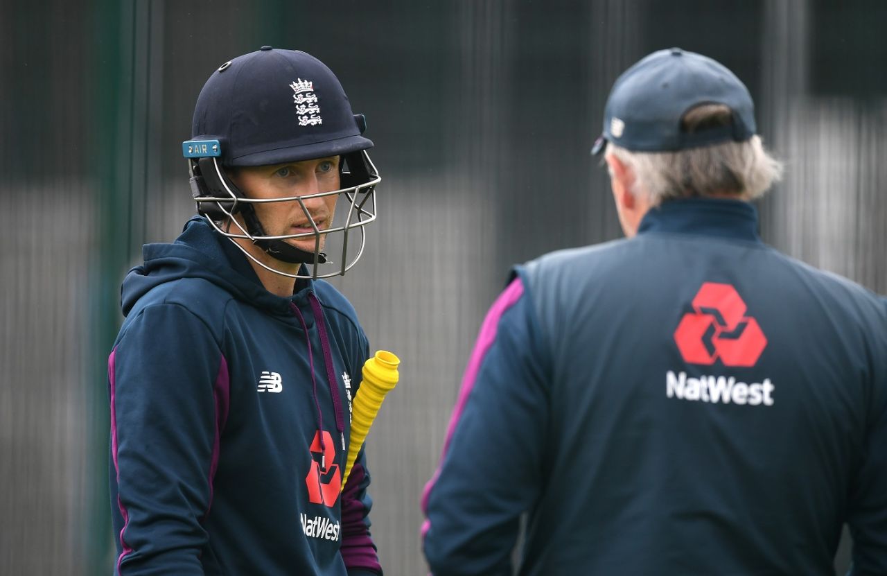 Joe Root talks to head coach Chris Silverwood during a practice session, Manchester, July 14, 2020