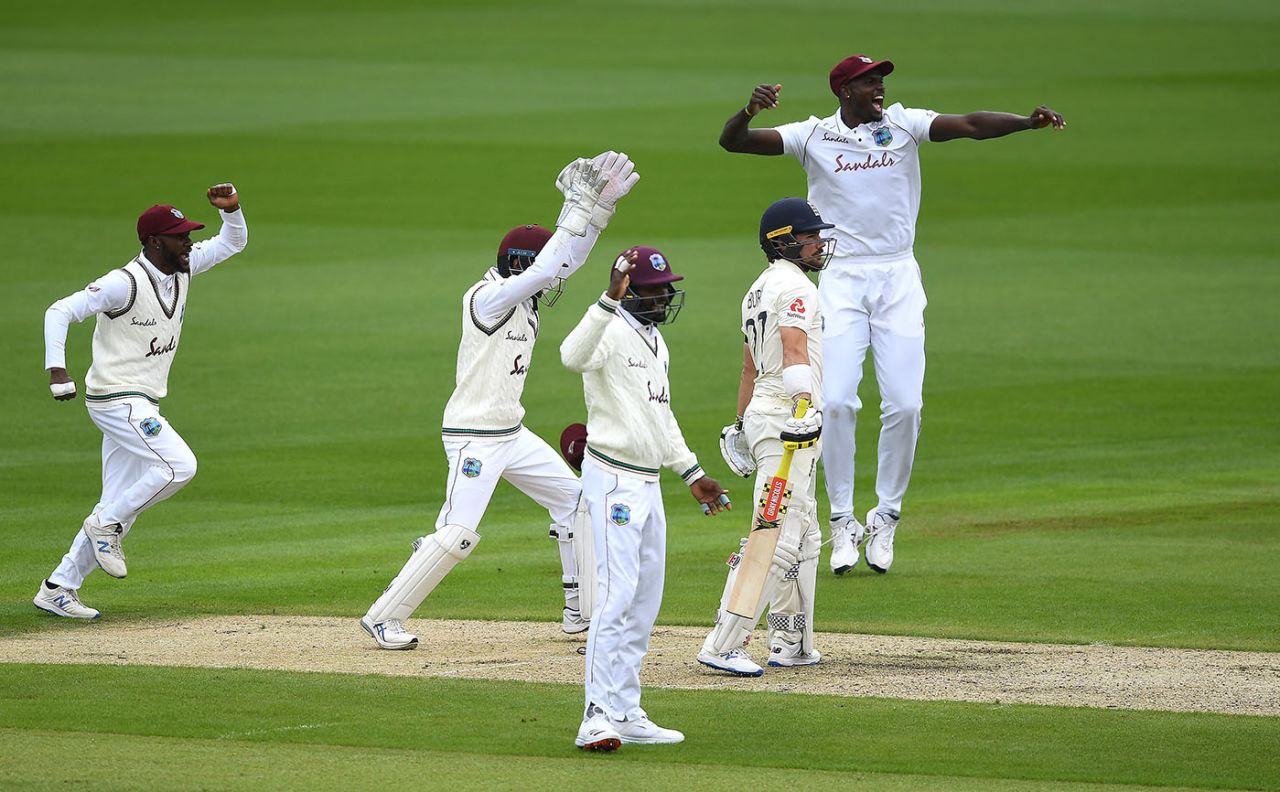 West Indies celebrate the wicket of Rory Burns, trapped lbw by Roston Chase, England v West Indies, 2nd Test, Old Trafford, July 16, 2020