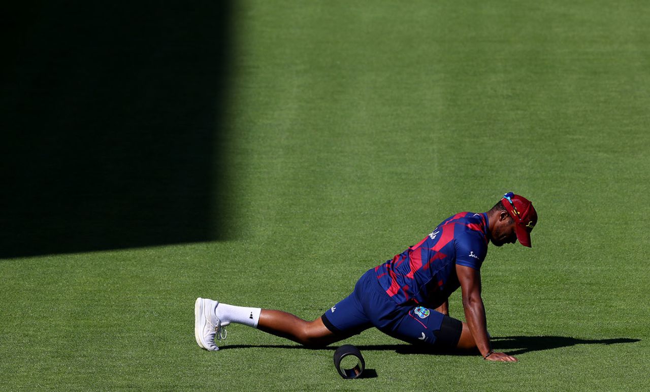 Shannon Gabriel has a stretch during the warm-ups on the fourth morning, England v West Indies, 2nd Test, Emirates Old Trafford, 4th day, July 19, 2020