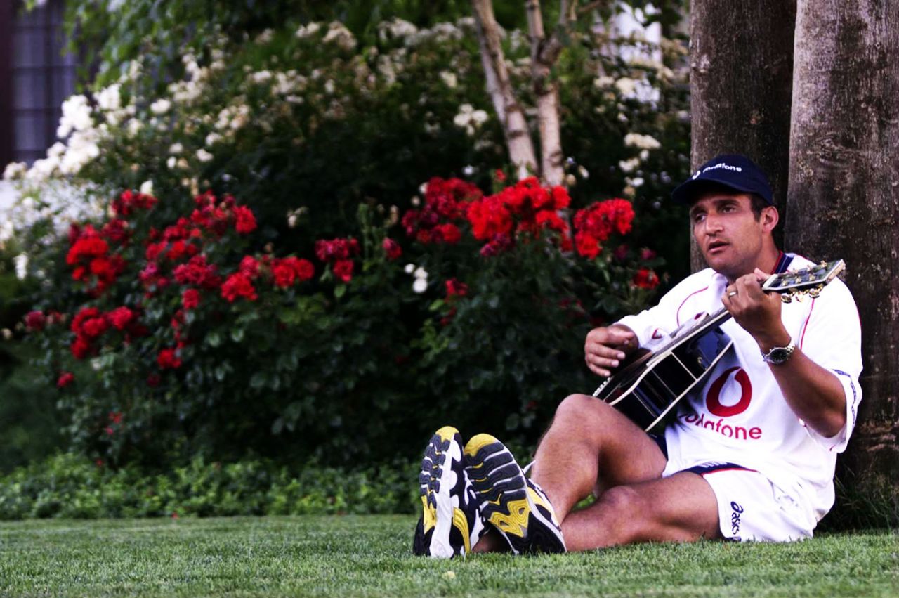 Mark Butcher plays the guitar in the gardens of the England team hotel in Bloemfontein, November 1, 1999