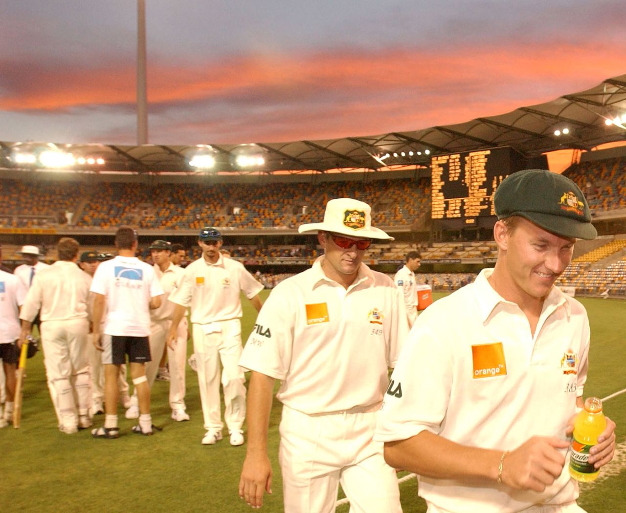 The Australia players walk off the field at the end of the match, Australia v New Zealand, 1st Test, day five, Brisbane, November 12, 2001