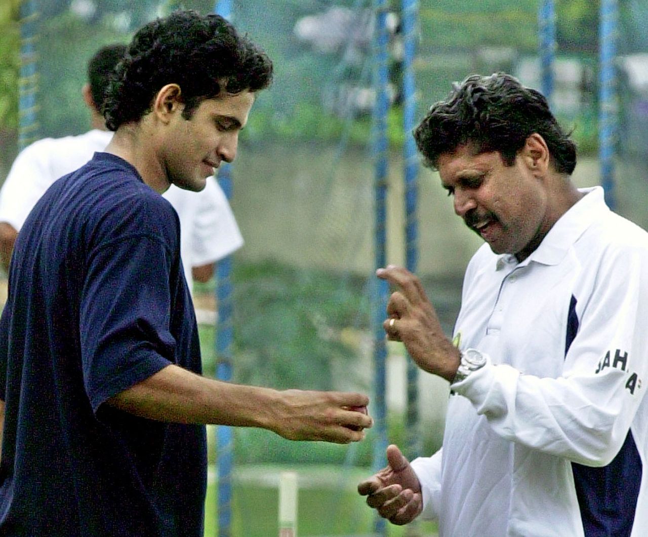 Kapil Dev talks to Irfan Pathan at the National Cricket Academy, Bangalore, June 11, 2004