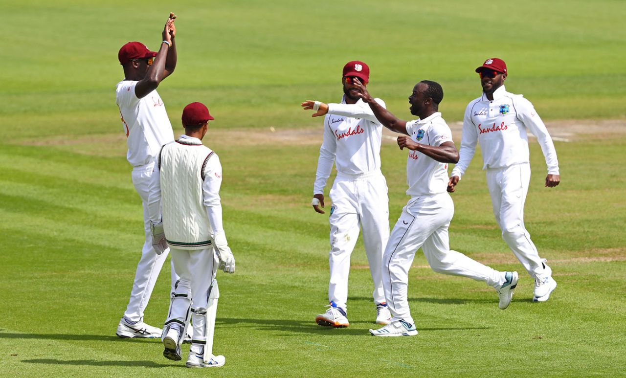 Kemar Roach celebrates with his team-mates, England v West Indies, 3rd Test, Old Trafford, 1st day, July 24, 2020