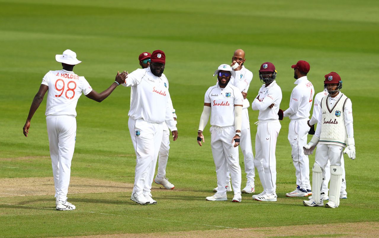 Rakheem Cornwall is congratulated by his captain on a slip catch, England v West Indies, 3rd Test, Old Trafford, 1st day, July 24, 2020