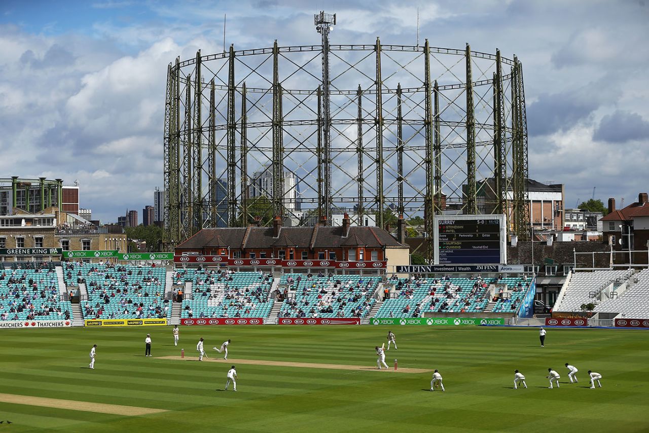 A socially distanced crowd watches on in front of the gas holder, Surrey v Middlesex, The Oval, July 26, 2020