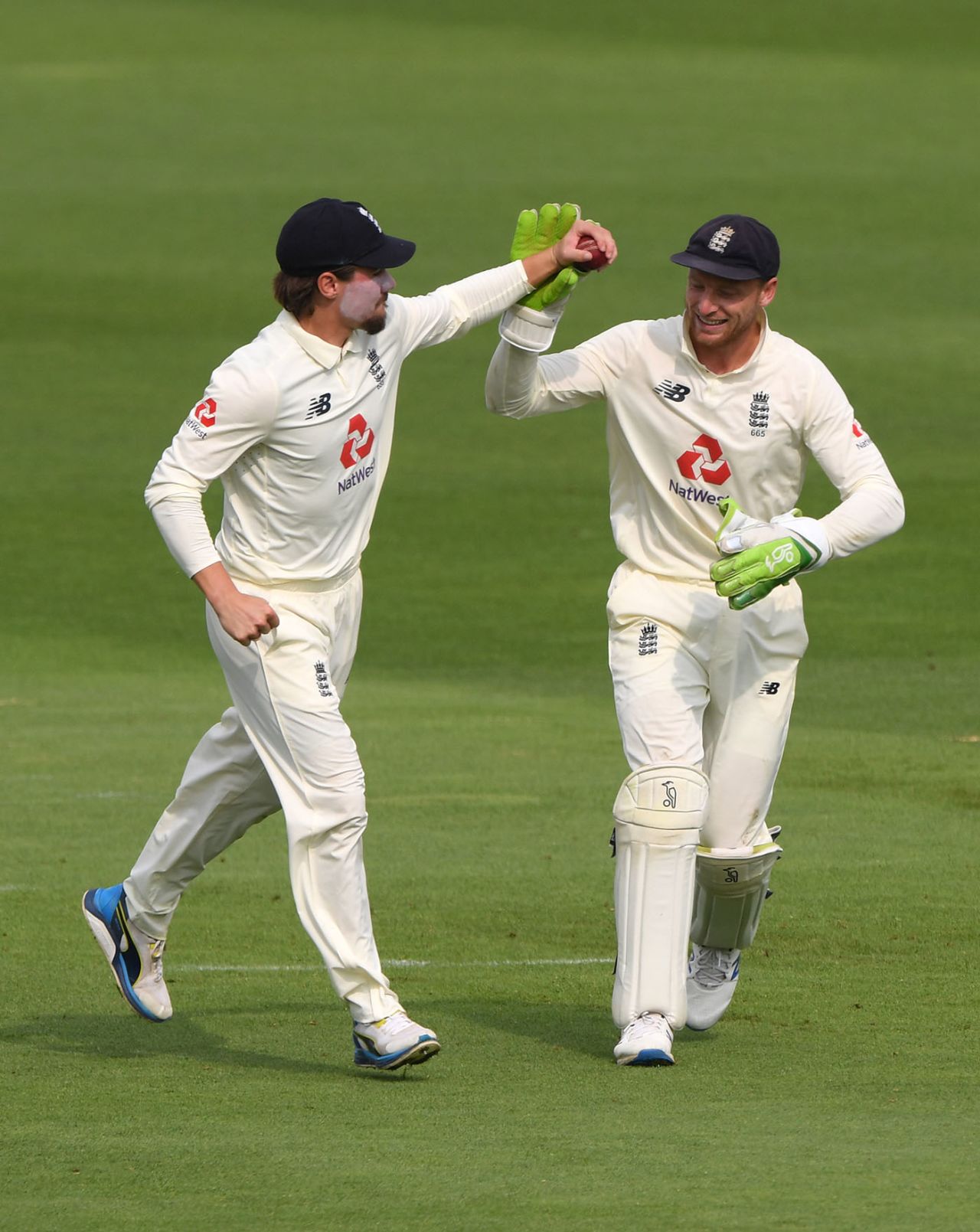 Rory Burns and Jos Buttler celebrate the wicket of Abid Ali, England v Pakistan, Ageas Bowl, 2nd Test, 1st day, August 13, 2020