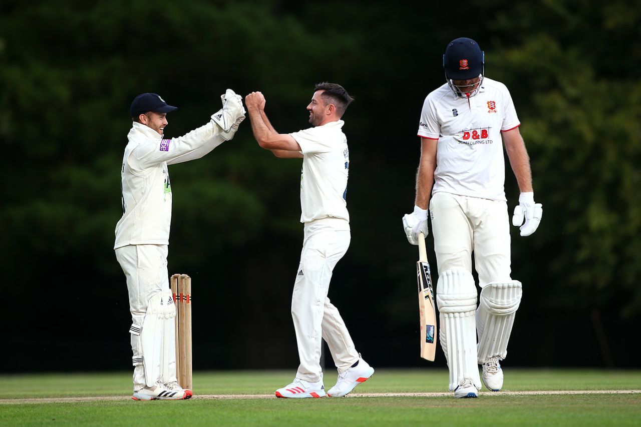 Ian Holland celebrates with wicket keeper Lewis McManus after taking the wicket of Paul Walter, Bob Willis Trophy, Hampshire v Essex, Arundel, August 23, 2020