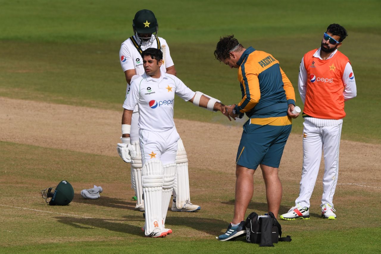 Abid Ali receives treatment from the Pakistan physio after copping a painful blow on his left hand from James Anderson, England v Pakistan, 3rd Test, Southampton, 4th day, August 24, 2020