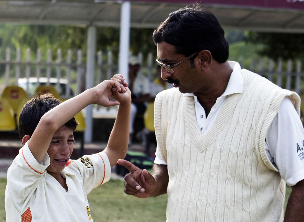 Asif Bajwa reprimands a young cricketer in Islamabad, November 3, 2011