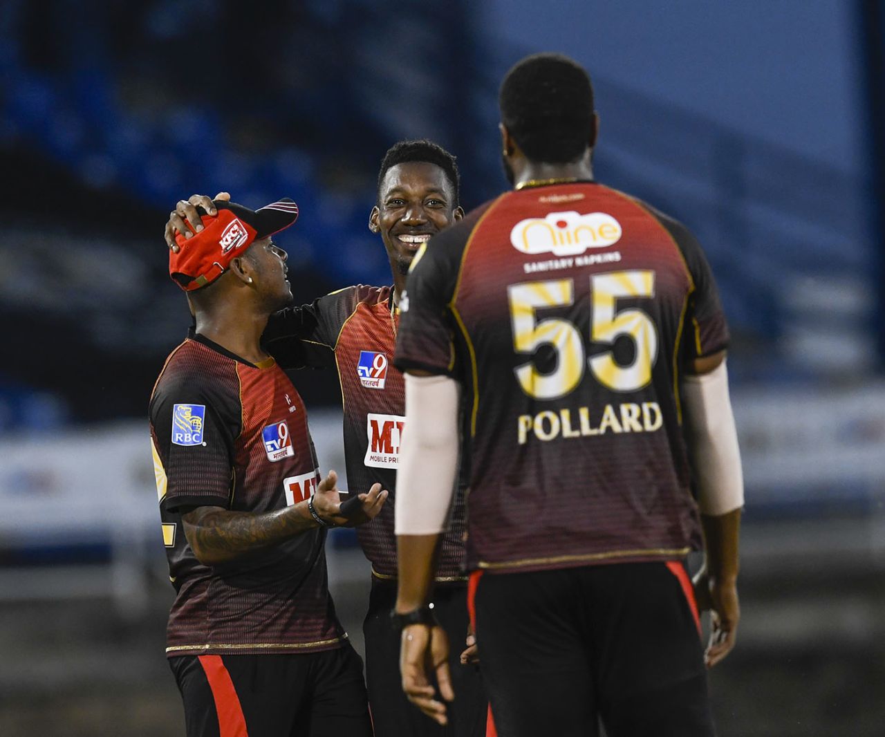 Khary Pierre celebrates a breakthrough with Tion Webster and Kieron Pollard, Trinbago Knight Riders v Guyana Amazon Warriors, Port-of-Spain, CPL, August 27, 2020
