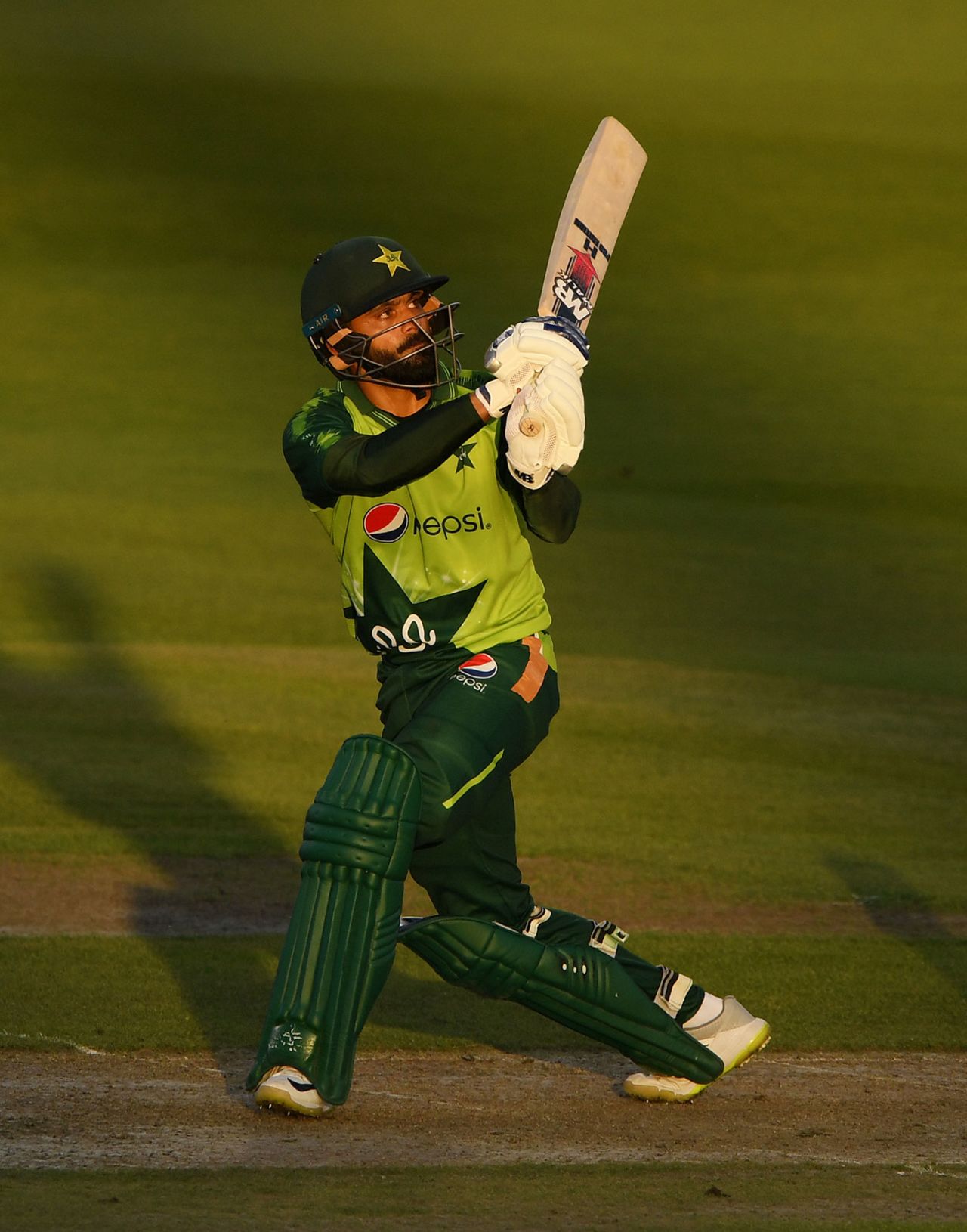 Mohammad Hafeez launches another shot over the leg side, England v Pakistan, 3rd T20I, Old Trafford, September 1, 2020