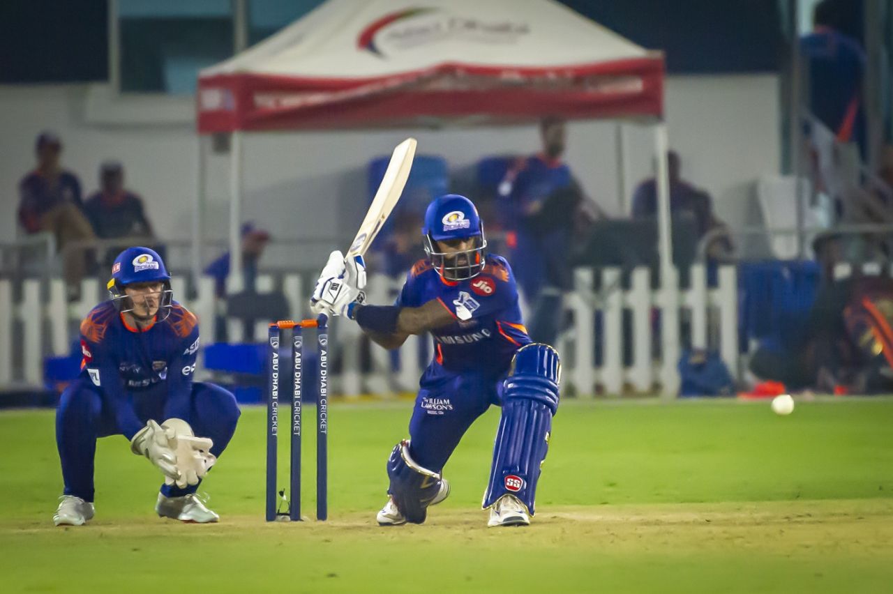 Suryakumar Yadav gets down to sweep as Quinton de Kock looks on during a Mumbai Indians intra-squad practice match, Abu Dhabi, September 10, 2020