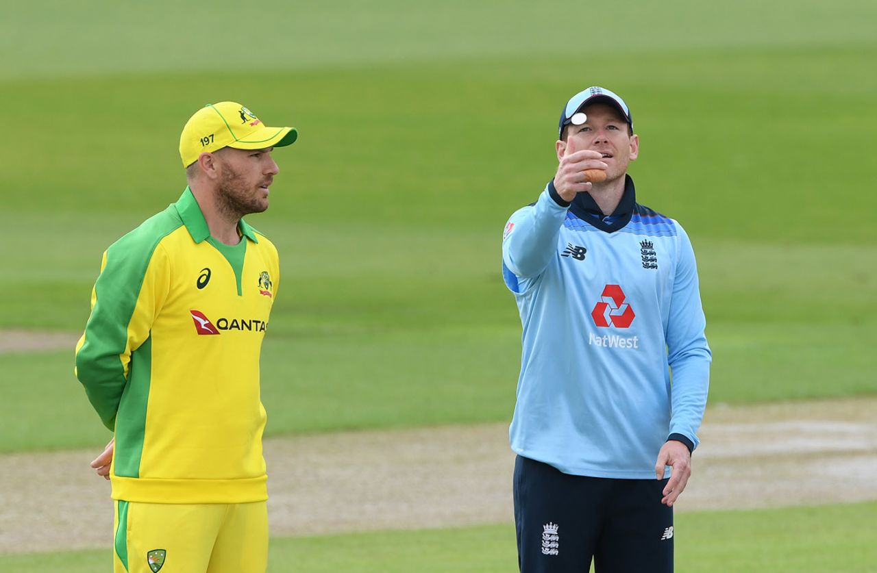 Eoin Morgan tosses the coin as Aaron Finch looks on, 1st Royal London ODI, England v Australia, Emirates Old Trafford, September 11, 2020