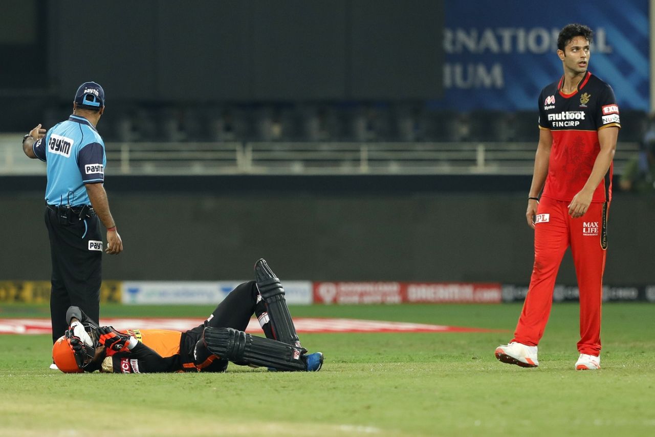 Rashid Khan is down after a mid-pitch collision with Abhishek Sharma. Bowler Shivam Dube looks on, Sunrisers Hyderabad v Royal Challengers Bangalore, IPL 2020, Dubai, September 21, 2020 