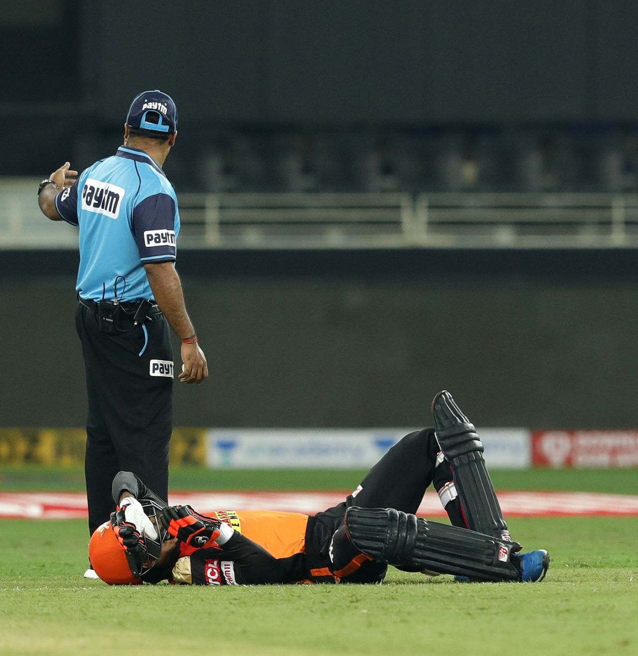 Rashid Khan is floored after a mid-pitch collision with batting partner Abhishek Sharma 