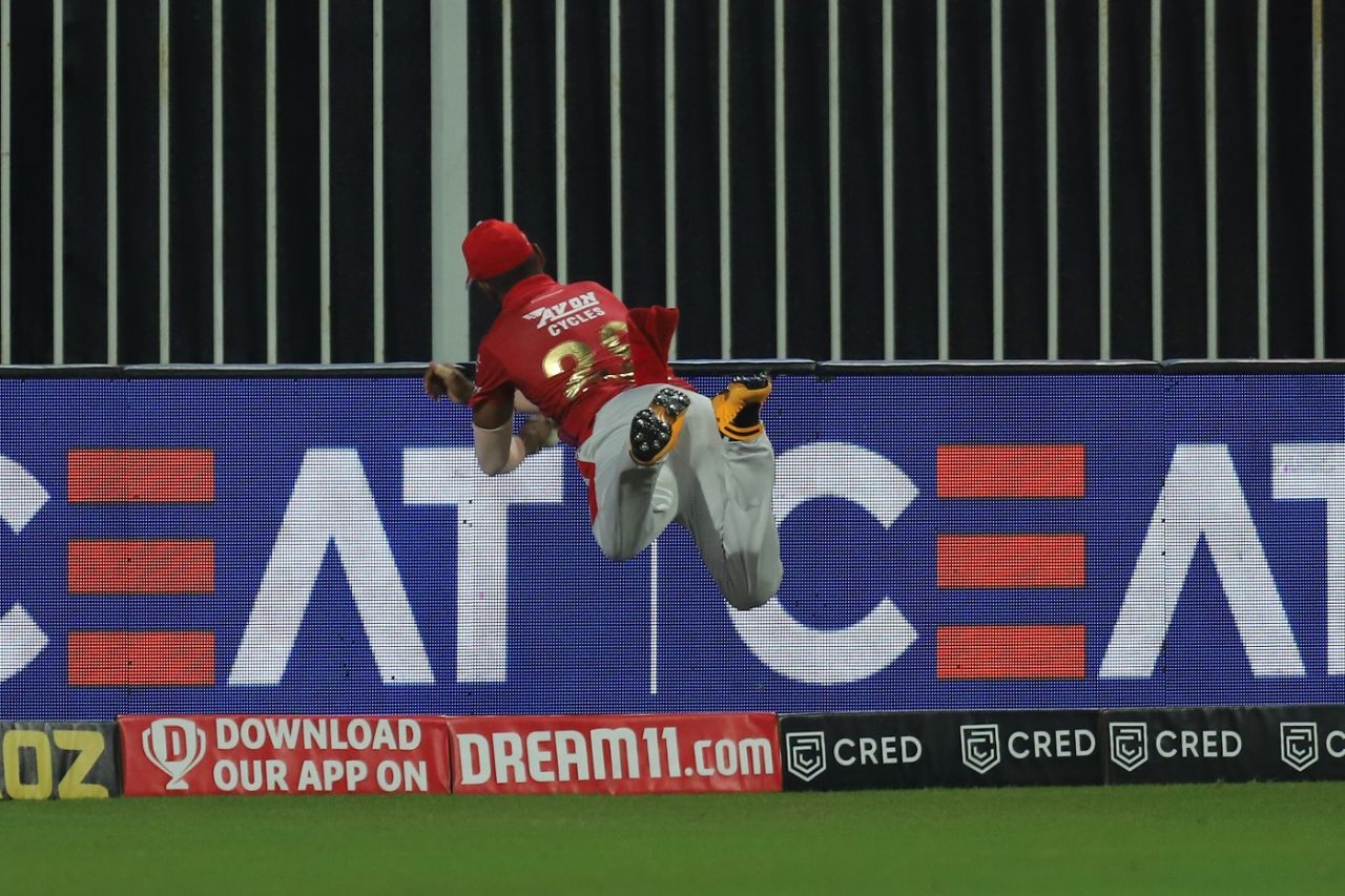 Nicholas Pooran knows momentum is carrying him over, so he prepares to flick the ball back mid-air, Kings XI Punjab v Rajasthan Royals, IPL 2020, Sharjah, September 27, 2020
